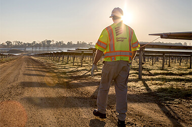 Dominion Energy Employee Walking in Solar Field