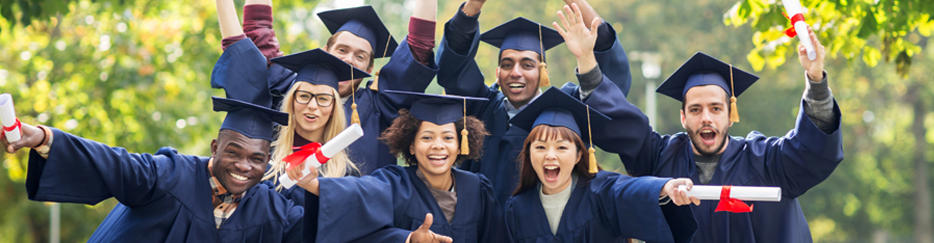 diverse people in caps and gowns