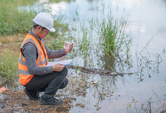 Scientist Monitoring Groundwater Levels