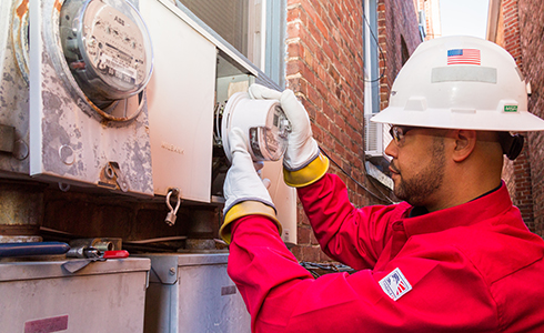 employee installing meter