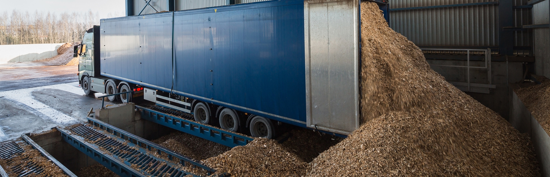 truck unloading woodchips