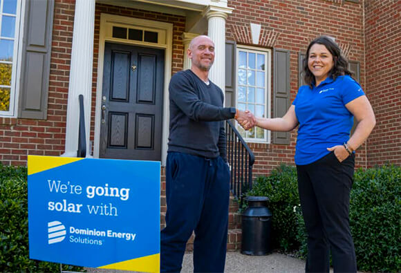 Dominion Energy Employee Shaking Hands With Customer