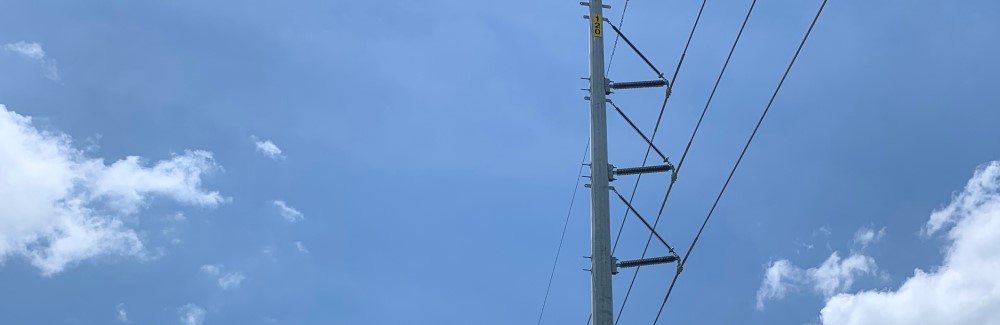 Power lines against a blue sky