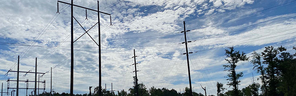 Power lines silhouetted against the sky