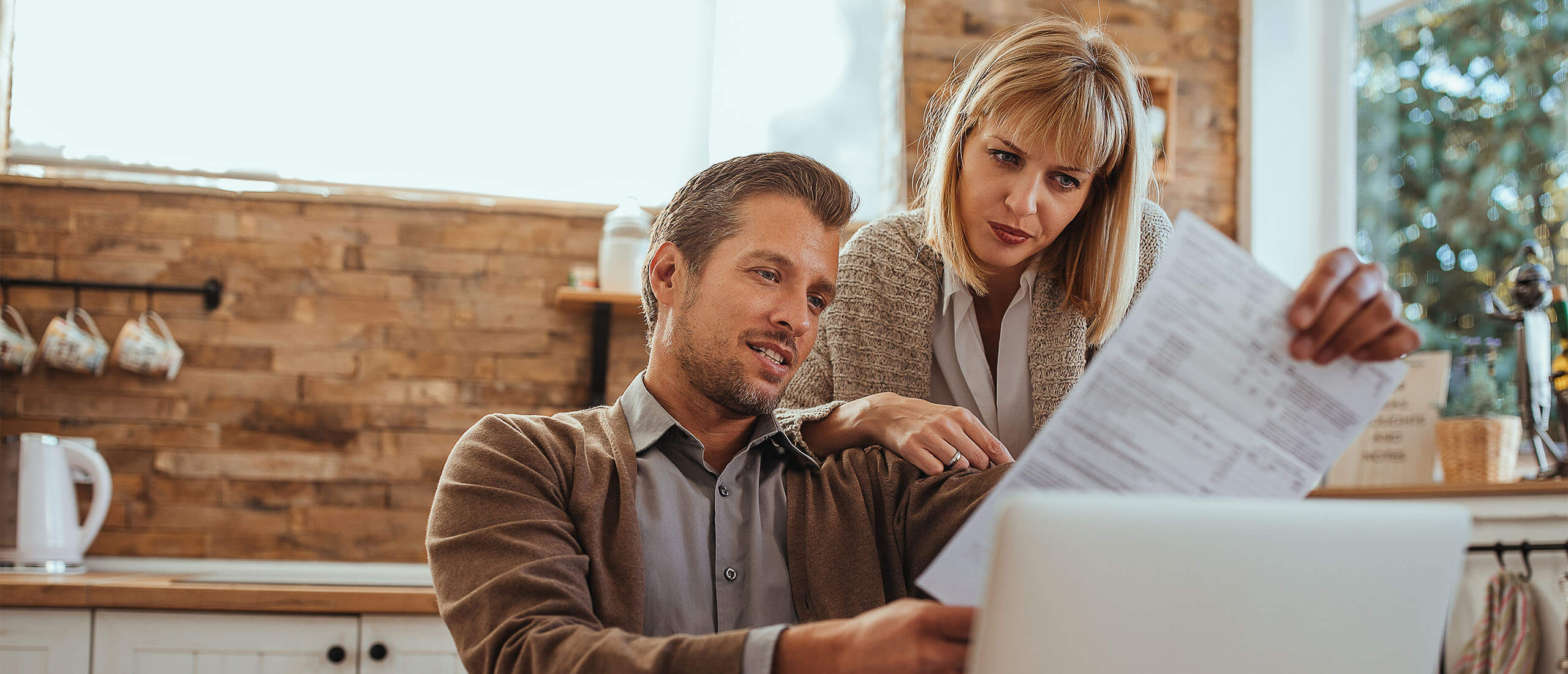 Couple Looking at Paper Billing Statement