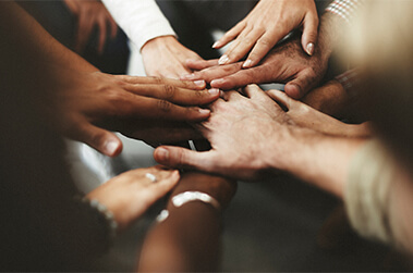 People With Joined Hands as a Team