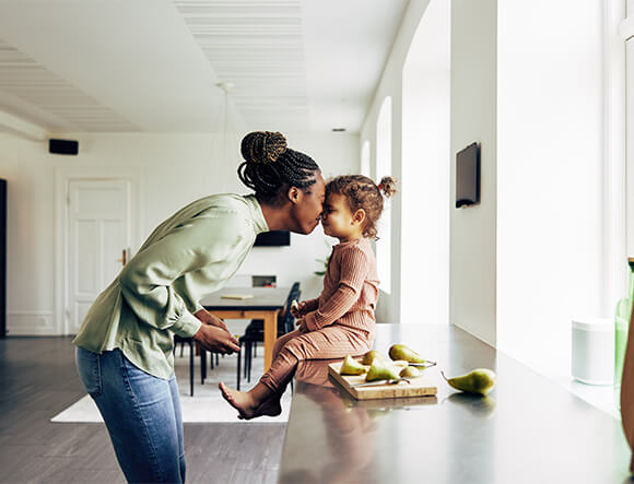 Mother and Daughter Sitting on Counter
