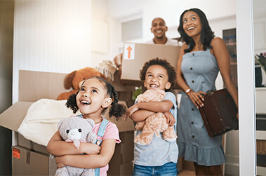 Family Walking Into New House