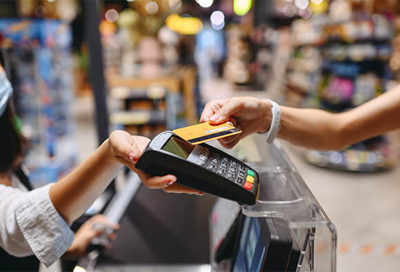Customer Paying Bill at Register With Credit Card