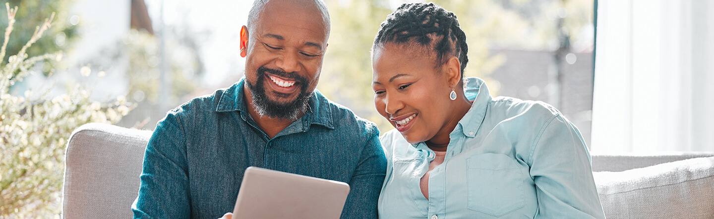 Couple Looking at Account on iPad