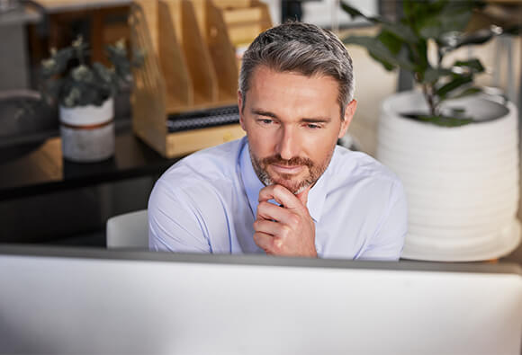 Business Executive Reviewing Computer