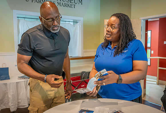 Explaining available assistance at an energy assistance event