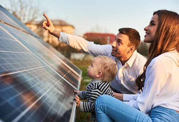 Family Looking at Solar Panels