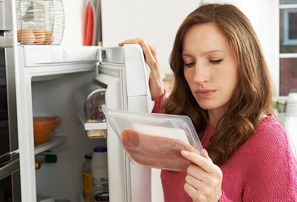 Lady Checking Quality of Food in Refrigerator