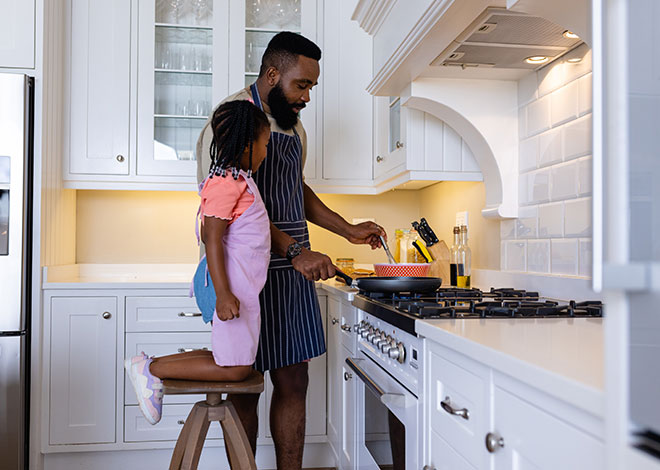 Father and daughter cooking