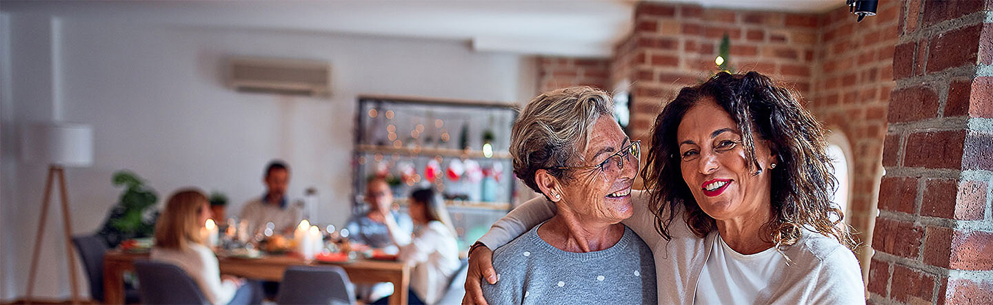 Mother and Daughter Posing for Picture in Kitchen