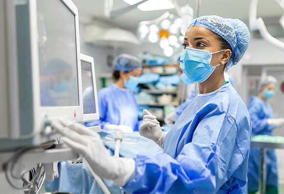 Operating Nurse Looking at Monitor