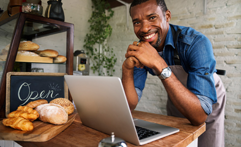 bakery owner with laptop