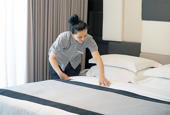Hotel Maid Making Bed