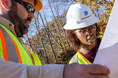construction workers looking at plans