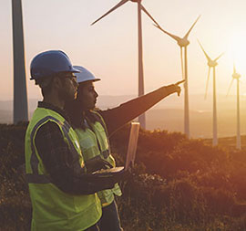 Workers and a wind turbine