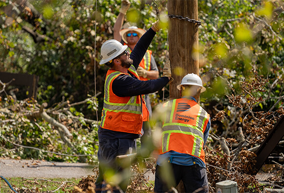 Dominion Energy Linemen Repairing Pole