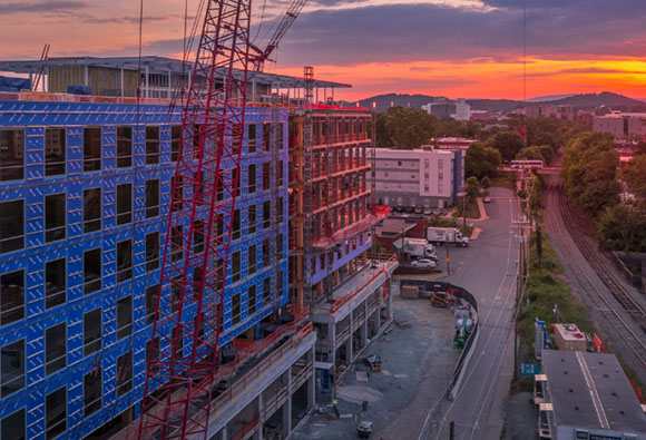 A construction site and a beautiful sunset