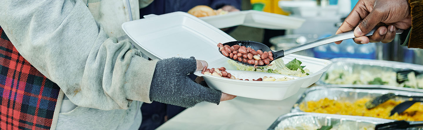 Volunteers feed the poor