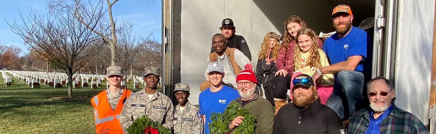 Volunteers laying wreaths at Arlington Cemetery